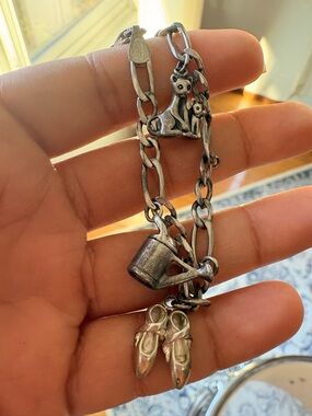Sterling vintage charm bracelet with 3 charms